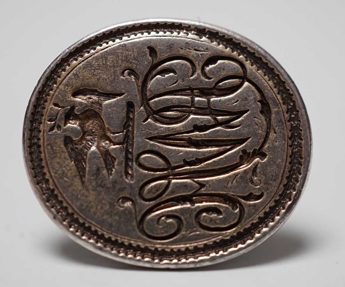A George III silver fob seal, the matrix engraved with monogram below a crest, indistinct maker's mark ?B, 25mm.